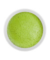 Whisked bowl of Japanese Matcha with smooth frothy layer, ceremonial style.