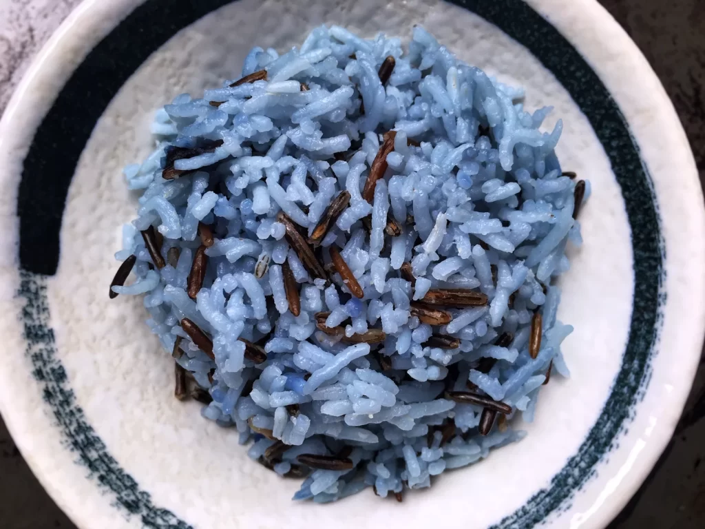 Blue Butterfly Pea Rice on a white plate – vibrant natural blue from butterfly pea flowers